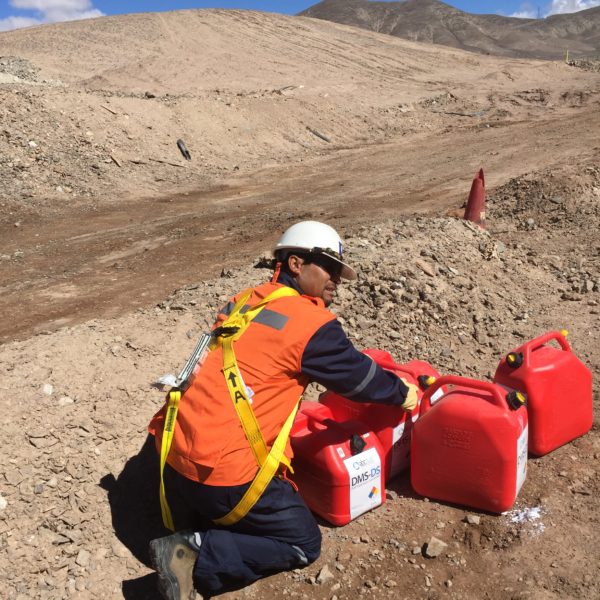 male road worker with orange containers