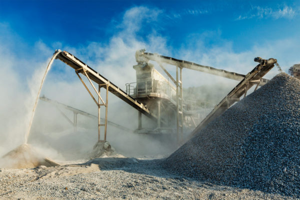 How do you control dust in a crushing plant?